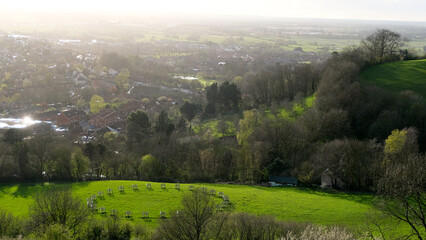 Scenic view of rural countryside and stone circle in the Somerset Levels from the Glastonbury Tor in England UK