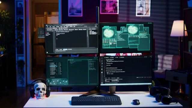 Panning shot of high tech computer system running malicious code in empty apartment. PC monitors in empty neon lit criminal hideout used by hackers to commit illegal activities