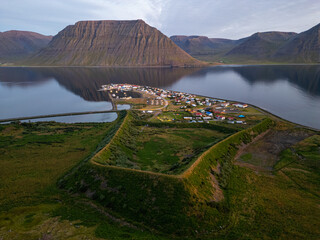 Evening aerial shot of town of Flateyri in the Westfjords of Iceland