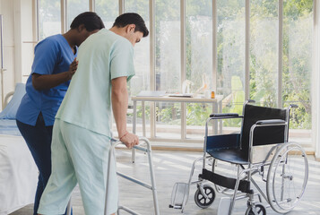 Portrait patient caucasian man sit wheelchair with woman nurse black people carer physical...