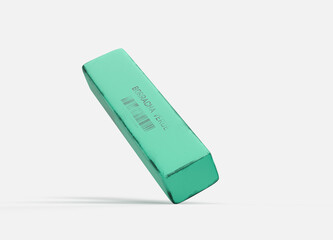 old school green eraser, rectangular model with black spots on white background