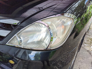 Car headlamps that have become somewhat cloudy.
