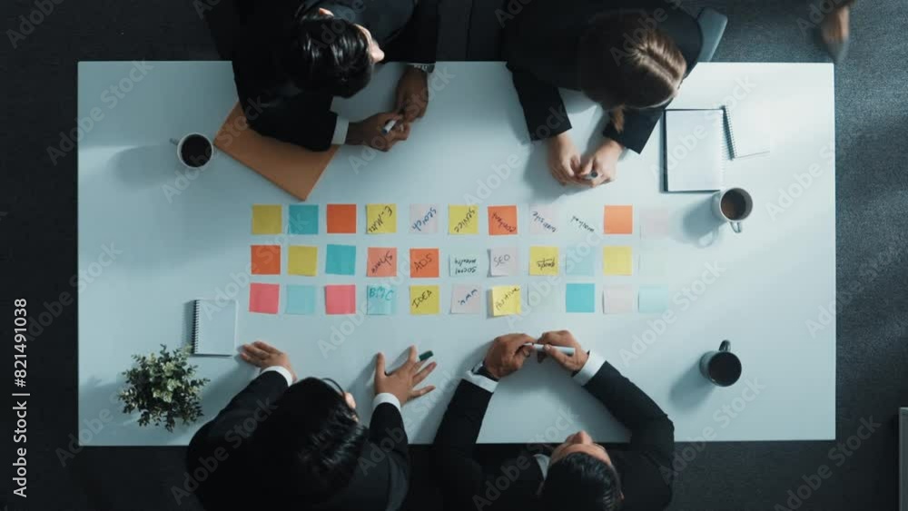 Poster top view of professional business people working on sticky notes. project manager writing marketing 