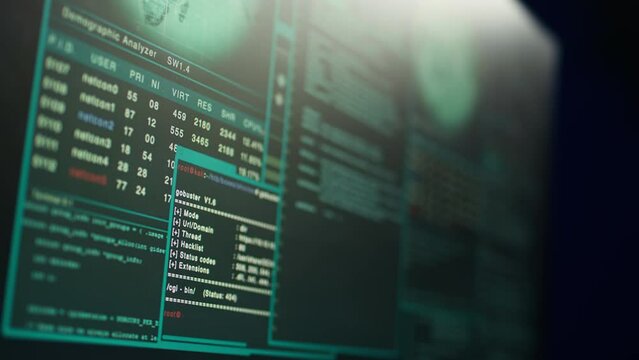 Close up shot of dangerous hacking code running on high tech computer system monitors. Programming scripts shown on PC displays in empty criminal hideout used by hackers to commit illegal activities