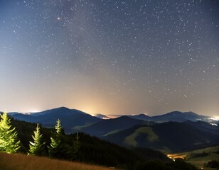 Starry sky at night above the mountain range
