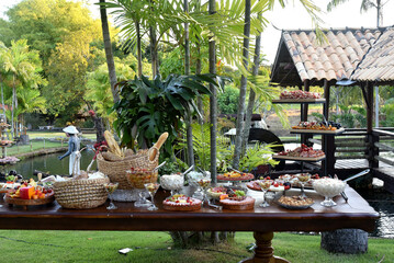 table cheeses paes finger food grapes and salads party buffet wedding decoration dishes flowers arrangements restaurant dining table