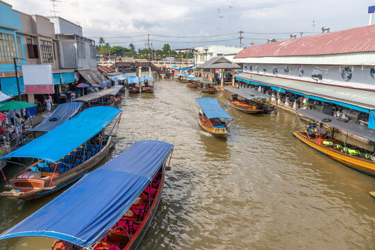 Tourist boats on the canal at Ampawa floating market, Thailand