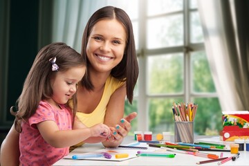 Mother and child painting art at home