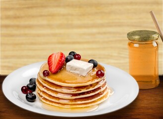 Stack of traditional tasty pancakes on plate