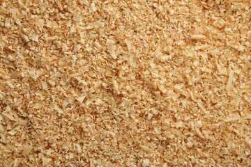 Dry natural sawdust as background, top view