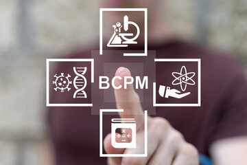 Man using virtual touch screen presses abbreviation: BCPM. BCPM Biology Chemistry Physics Math...