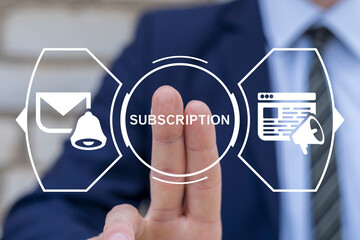 Business man working on virtual touch screen presses button with word: SUBSCRIPTION. Subscribe to...