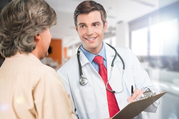 Shot of doctor talking medical treatment to patient in consultation.