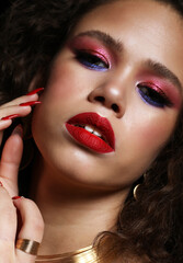 Beautiful gorgeous African American fashion model with bright make up and and afro hair