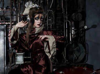 Young female with bright makeup, zombie style in steampunk scenery.