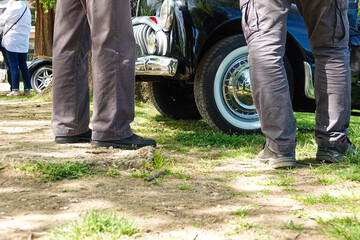 conversation between car drivers at a car show