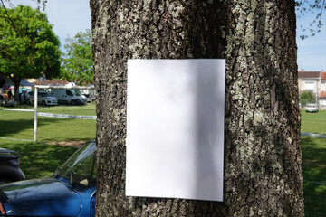 Advertising mockup on a piece of paper attached to a tree - Powered by Adobe