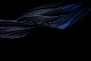 Blue silver shinny fabric flying in curve shape, Piece of textile blue silvery fabric throw fall in...