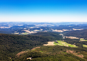 Fototapeta premium Soaring over valleys, nature's canvas.