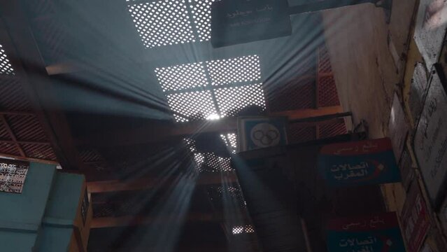 Sunbeams through the wooden lattice roof of Fez Medina. Low angle
