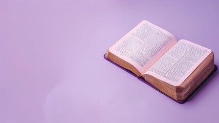 Open book with text on purple surface