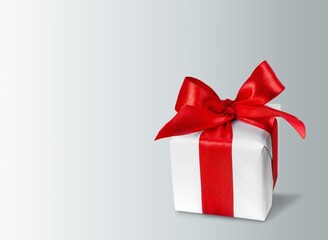 White gift box with beautiful red ribbon