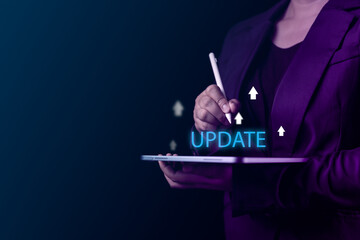 Tablet held by a businessman shows a virtual screen with updates to operating systems and application development, highlighting modern tech advancements in the business environment
