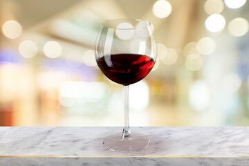 Red wine in glass on stone desk