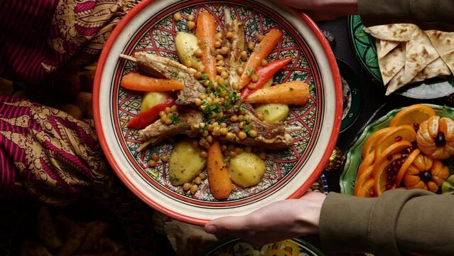 Eid al-Adha or the Feast of Sacrifice is the holidays celebrated in Islam. The family eats dishes of sacrificial lamb meat