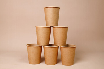 Arrangement Of Creative Pile Papercup Over Beige Background
