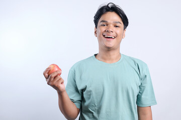 Smiling Face Young Asian Guy Holding Apple Fruit Isolated On White Background