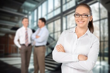 Happy young business woman in modern office