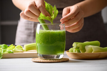 Celery green juice in glass decorative with leaf, Healthy drink for detox, Homemade cooking