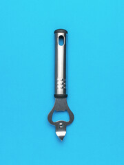 Stainless Steel Bottle Opener Against Solid Blue Background