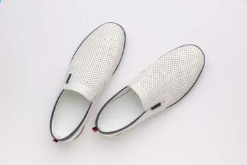 Minimalist White Leather Slip-On Shoes on Clean Background - Fashion Footwear Photography