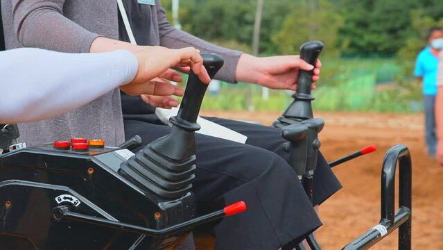Mini Excavator Operator CloseUp Hands Control in Action in Korea