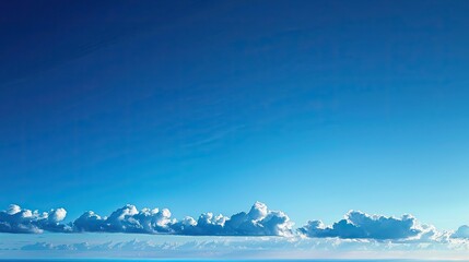 A clear blue sky, gradient bright blue.