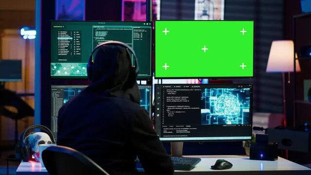 Cybercriminal using AI machine learning and isolated screen PC to develop system exploits. Hacker using artificial intelligence tech and mockup monitor to build script tricking firewalls, camera A
