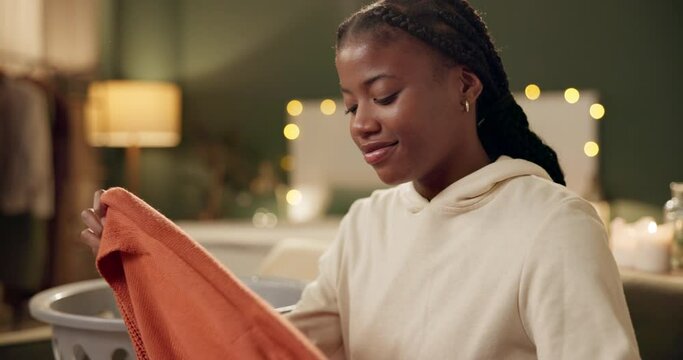 Laundry, scent and woman smell clothes in home and like perfume of detergent or clean fragrance. Fabric, cleaner and girl enjoy aroma of fresh linen, textile and fold washing in basket in bedroom