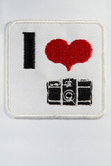 an embroidered emblem depicting a love of photography