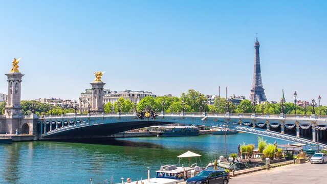 A timelapse of the Eiffel Tower along the river Seine with flyboats passing by with motion blur.Sunny but cloudy spring summer day paris city famous riverside bay tower view bridge timelapse panorama