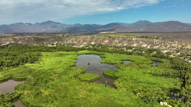 Drone approaching the Mirador Santiago de Yola Oasis, in sunny Baja California Sur Mexico