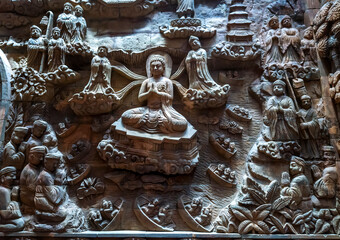Stone carved base-relief of Ky Lan temple in Ninh Binh, Vietnam. Human figures and floral ornament...