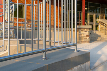 Example of a stainless steel railing along an exterior set of stairs at a public, commercial...