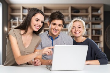 Group of smiling students study together