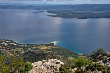 Scenic view from the mountain peak on Brac island to Zlatni Rat promontory