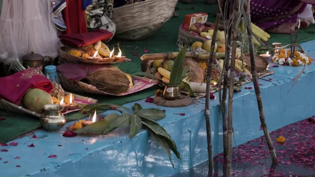 holy religious offerings with oil lamp and fruits for hindu sun god at chhath festival