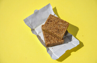 unpacked bouillon cubes on yellow background