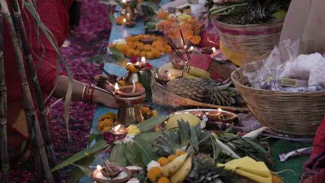 holy religious offerings with oil lamp and fruits for hindu sun god at chhath festival