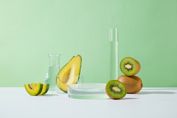 Green background template of avocado and kiwi theme with laboratory concept, empty round glass...